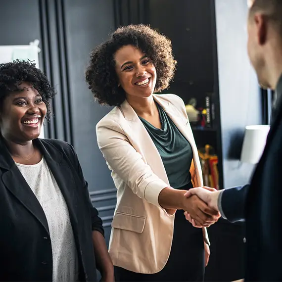 BFC consultants greeting a client